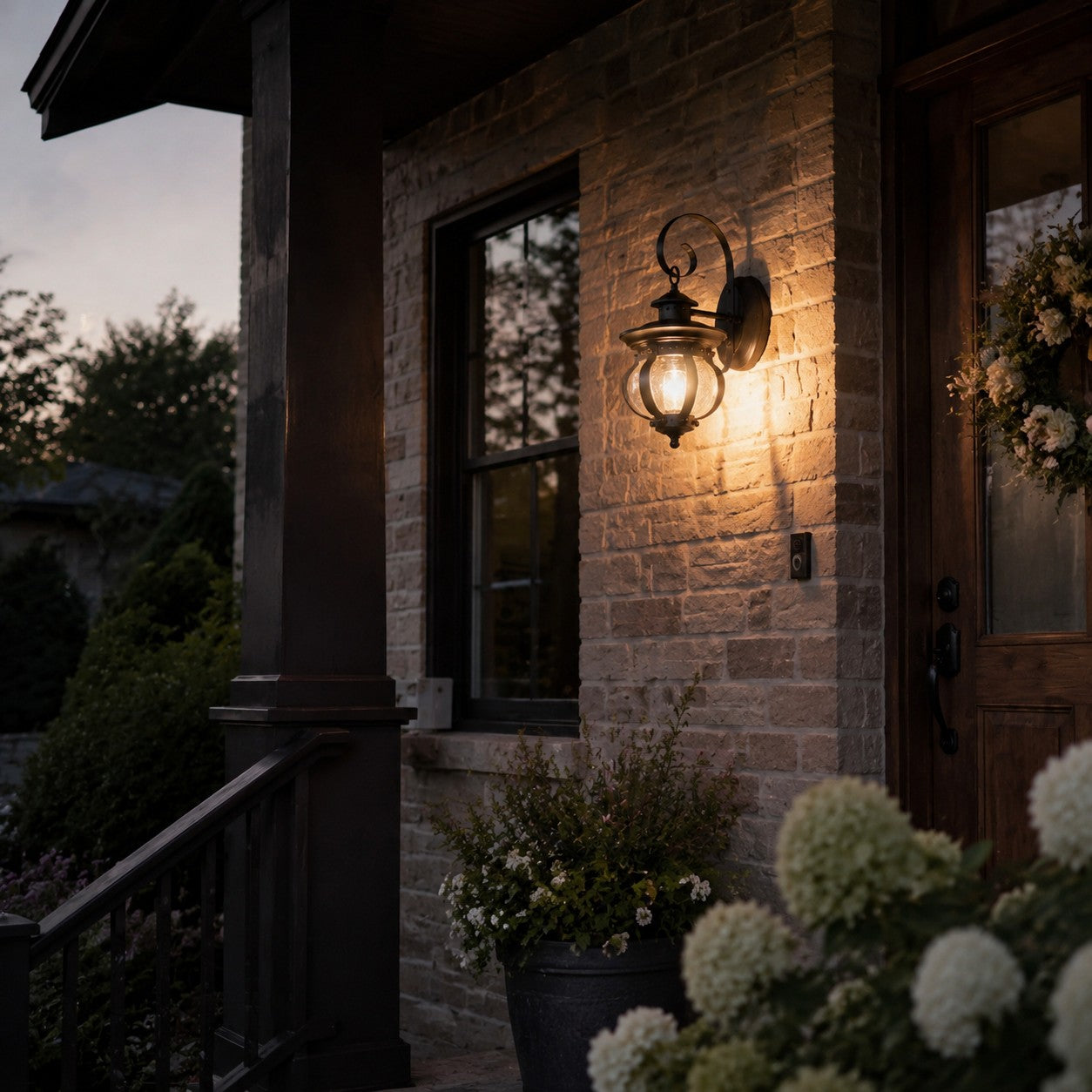 Outdoor wall lantern beside a stone entry wall