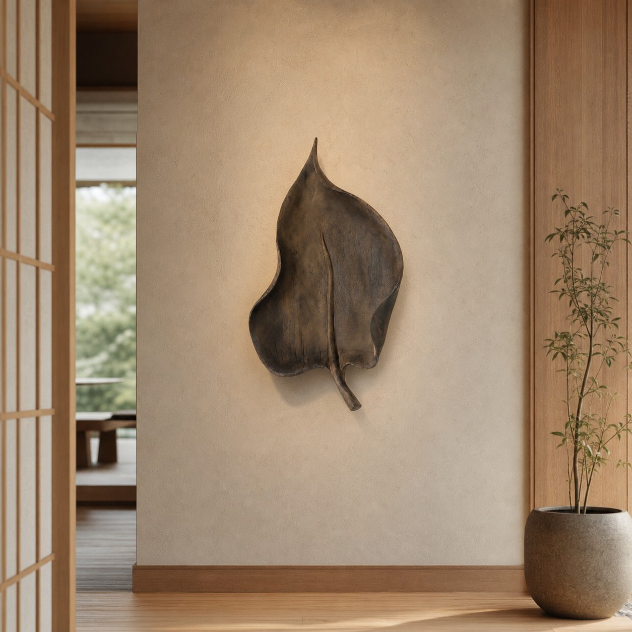 Large leaf wall decor in a wabi-sabi entryway