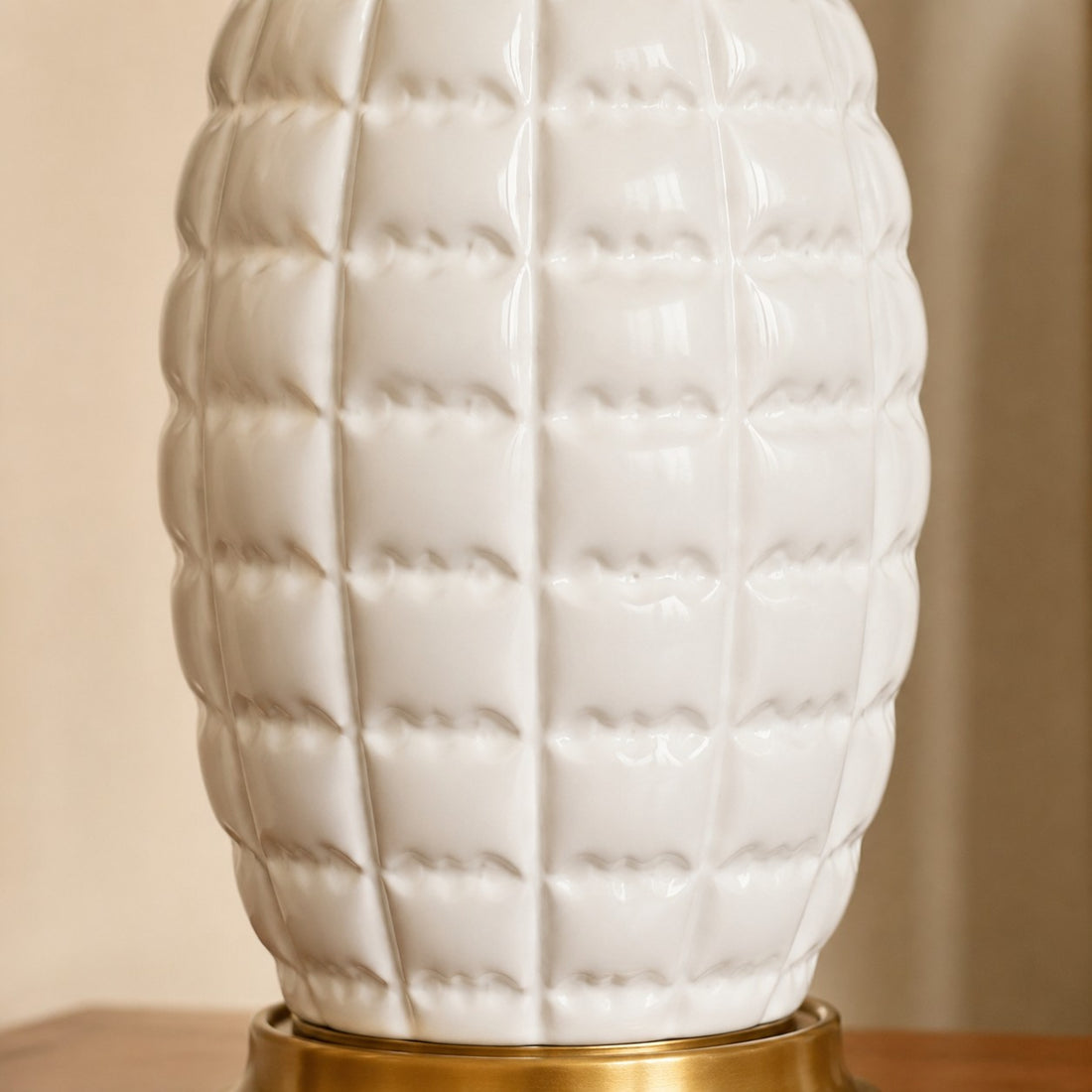 Close-up of sculpted white ceramic lamp base