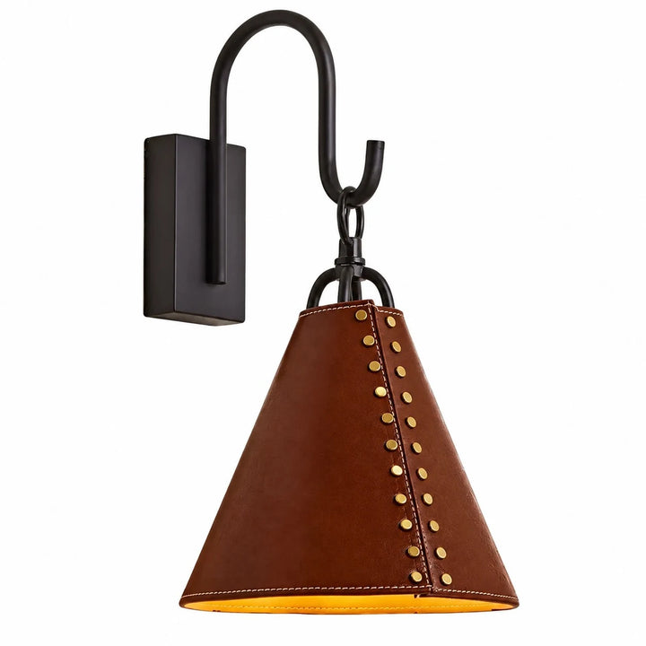 Black wall sconce with red leather cone shade and gold rivets