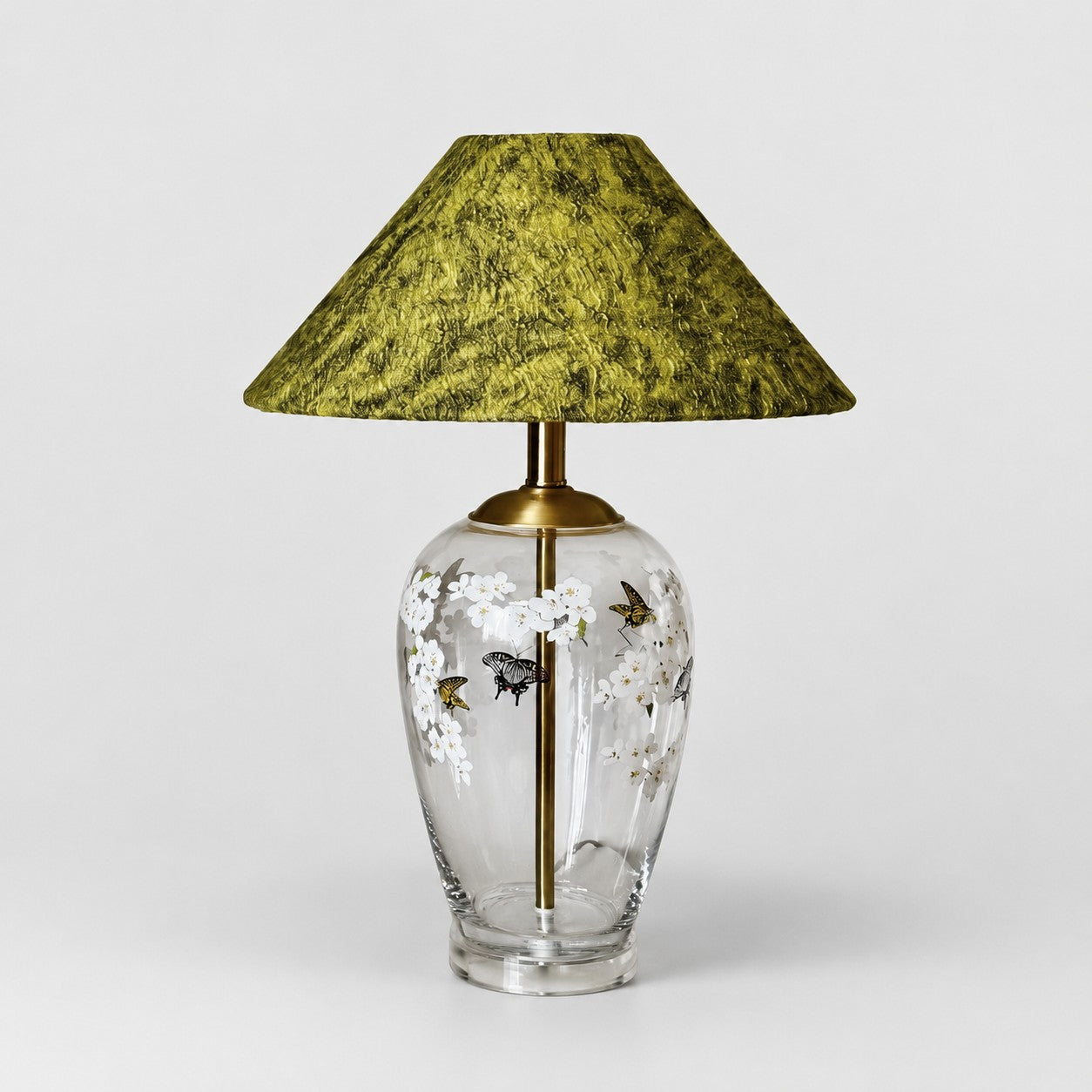 Floral glass table lamp with green textured fabric shade front view