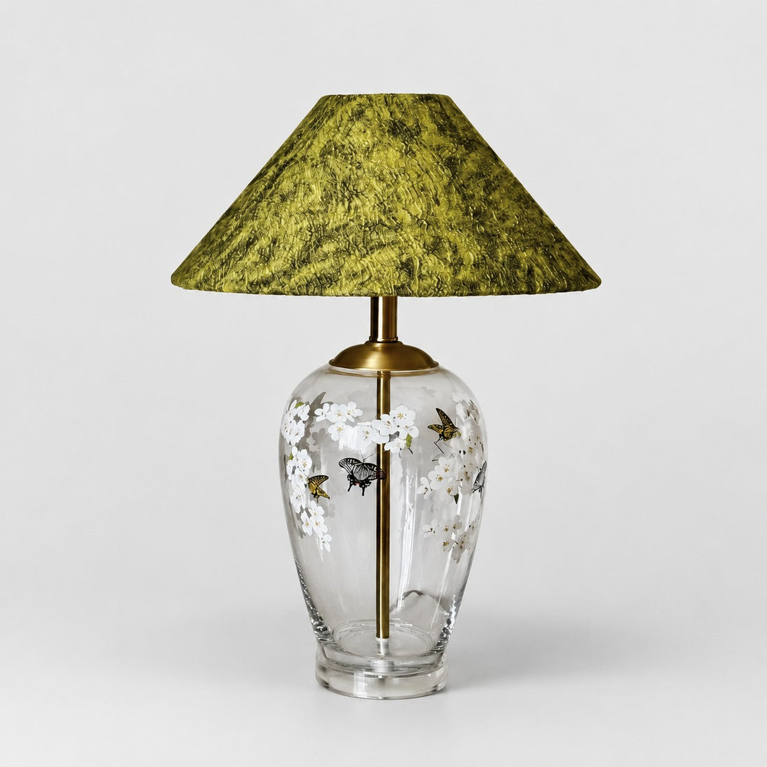 Floral glass table lamp with green textured fabric shade front view