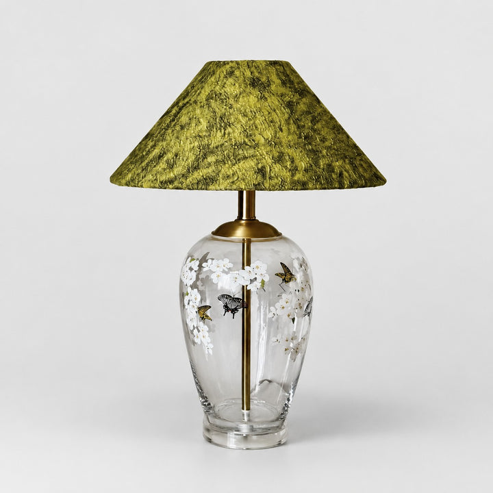 Floral glass table lamp with green textured fabric shade front view