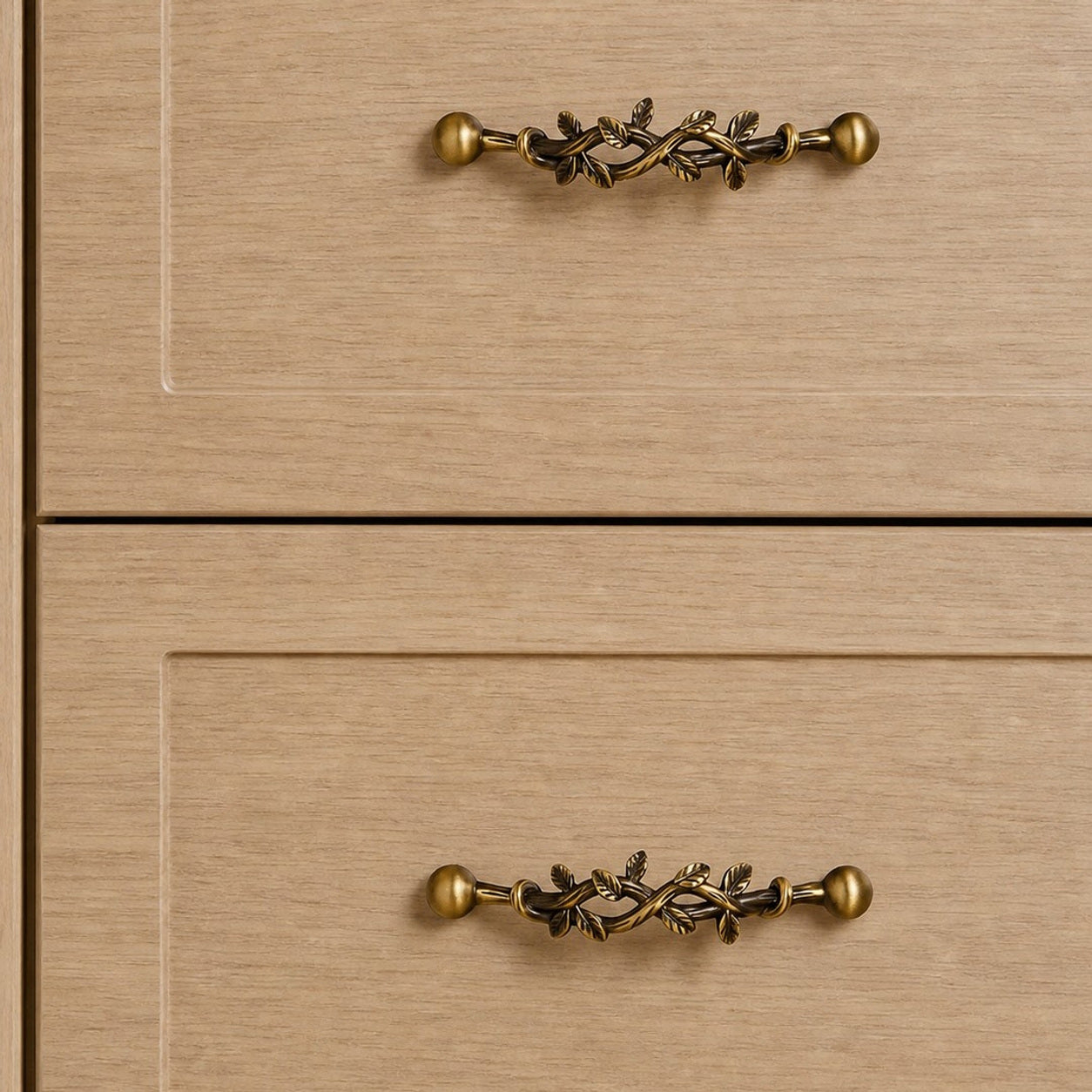 Leaf-shaped solid brass cabinet pulls installed on cabinet drawers